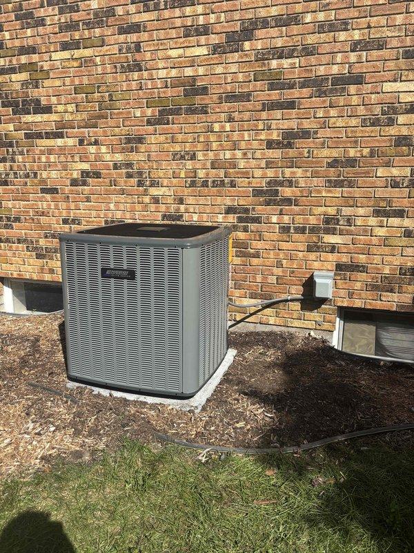 Completed full residential HVAC system installation including new furnace and air conditioning condenser unit. Installed outdoor AC condenser on concrete pad against exterior brick wall with proper clearances, connected refrigerant lines, installed electrical disconnect box with conduit, and completed all necessary piping connections. System tested and verified operational upon completion.