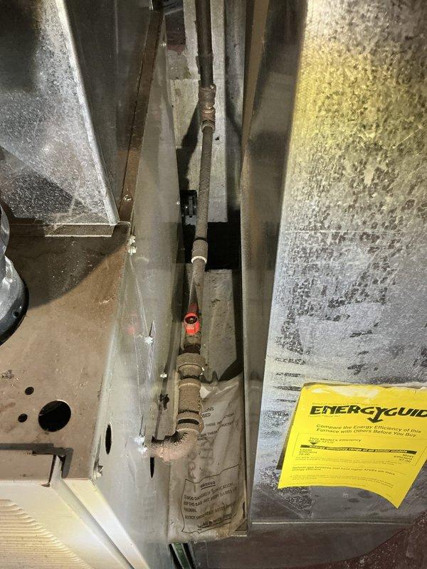Completed estimate for replacement of existing twenty-year-old furnace in single family residence. Inspected current HVAC system and documented condition of existing equipment including heat exchanger, copper refrigerant lines showing corrosion and mineral deposits, and aged insulation material on cylindrical components. Photographed electrical panel with multiple circuit breakers to assess power supply requirements for new installation. Provided homeowner with equipment options and installation recommendations for complete furnace replacement system.