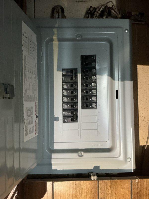 Completed estimate for replacement of existing twenty-year-old furnace in single family residence. Inspected current HVAC system and documented condition of existing equipment including heat exchanger, copper refrigerant lines showing corrosion and mineral deposits, and aged insulation material on cylindrical components. Photographed electrical panel with multiple circuit breakers to assess power supply requirements for new installation. Provided homeowner with equipment options and installation recommendations for complete furnace replacement system.