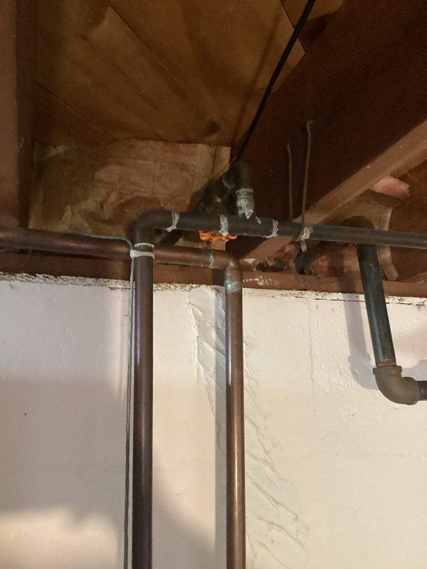 Replaced defective outdoor spigot with new 3/4-inch ball valve with drain as requested. The installation was completed in the basement utility area where multiple copper supply lines run along the foundation wall, ensuring proper connection to existing plumbing infrastructure and providing reliable freeze-proof functionality for exterior water access.