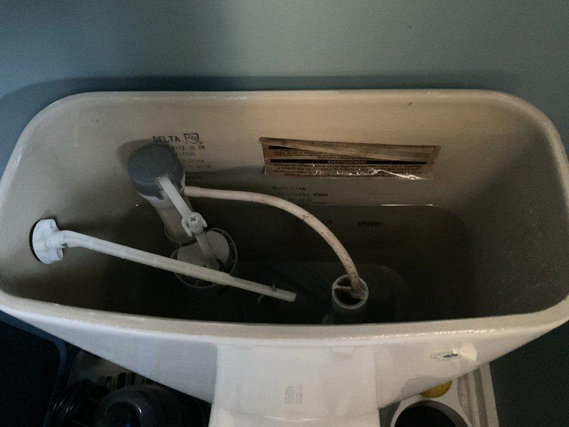 Responded to service call for non-operational garbage disposal unit with no power or sound. Upon arrival, verified disposal was completely inoperative with no humming or electrical activity detected. Updated customer contact information in system for future service coordination. Documented existing conditions with photographic evidence of plumbing fixtures in service area.