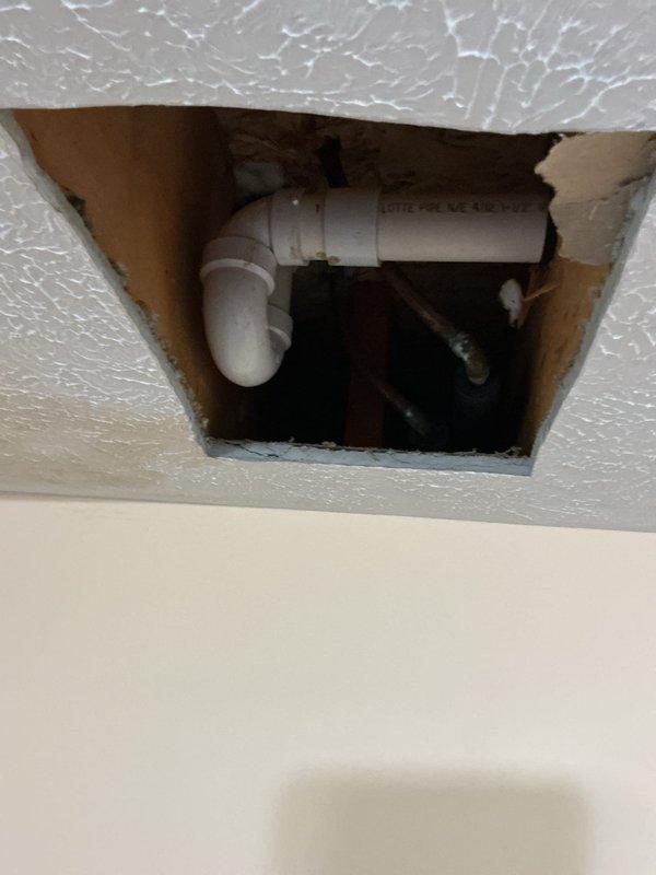Replaced tub drain assembly and recaulked all fixtures within the shower enclosure. Access was gained through the ceiling below to properly install the new drain assembly and ensure proper connection to existing plumbing. All fixtures were resealed with fresh caulking to prevent water intrusion and maintain a watertight seal.