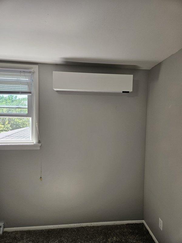 Completed installation of ductless mini-split air conditioning system in residential property. Mounted indoor wall unit in living space with proper clearances and positioned for optimal air distribution. Installed outdoor condenser unit and completed all refrigerant line connections, electrical wiring, and condensate drainage per manufacturer specifications. System tested and verified operational with all safety controls functioning properly.