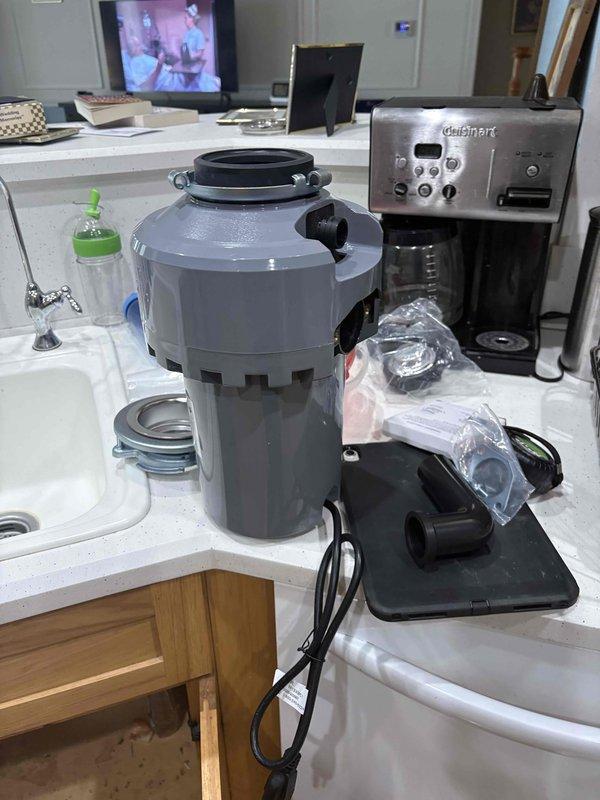 Completed garbage disposal replacement by removing existing unit and installing customer-provided disposal as a direct swap with no modifications to existing electrical or plumbing connections. Replaced drain assembly from sink basin through disposal unit to ensure proper drainage and seal. Verified all connections for leaks, tested disposal operation, and confirmed proper functionality of the complete system.