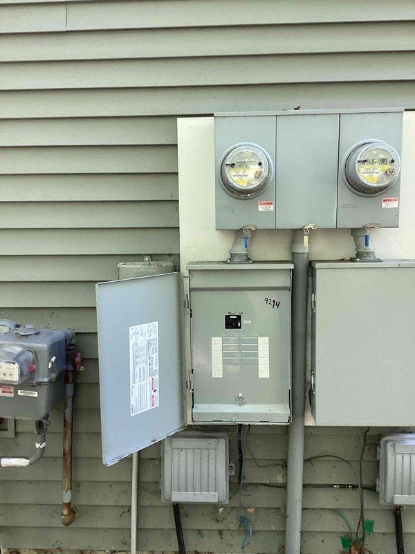 Conducted on-site assessment for whole-home generator installation at residential property with existing 200-amp electrical service. Documented current electrical infrastructure including dual metering configuration, main service panel, and available connection points to determine optimal generator placement and transfer switch requirements for Kohler system integration.