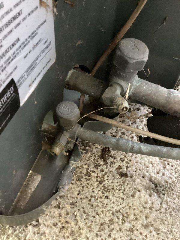 Completed annual cooling system maintenance and inspection on 2015 unit. Performed comprehensive tune-up including visual inspection of outdoor disconnect enclosure, gas valve assembly, and copper refrigerant lines. All components showed normal wear consistent with system age, with minor surface oxidation noted on outdoor electrical enclosure and dust accumulation on gas valves. System operating within normal parameters upon completion of preventative maintenance service.