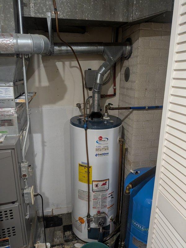 # Thermostat Troubleshooting and System Inspection

Responded to service call for non-functioning thermostat in residential property with 22-year-old HVAC system. Upon arrival, performed diagnostic assessment of heating system and thermostat controls. Inspected furnace operation, verified power supply to thermostat, and checked wiring connections at both thermostat location and equipment. Documented existing mechanical equipment configuration including water heater, HVAC unit, and associated plumbing infrastructure in basement utility area. Completed system evaluation and provided technical recommendations for thermostat replacement due to age and operational failure of existing control unit.