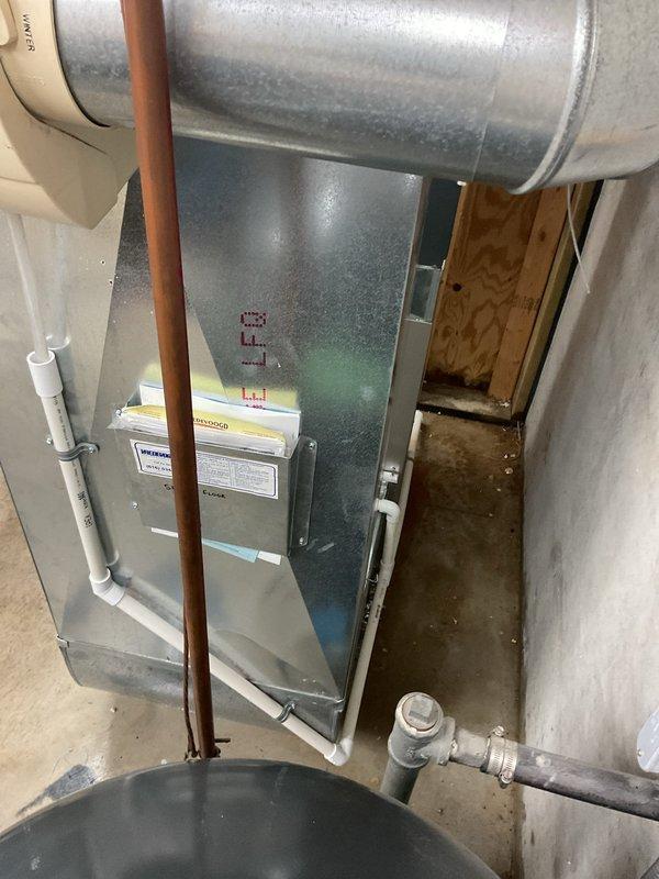 # Water Leak Service Completion

Responded to water leak concern in basement mechanical room. Upon inspection, examined HVAC air handler unit, associated ductwork, and surrounding plumbing infrastructure including copper refrigerant lines and PVC condensate drainage system. Verified all connections at condensate drain lines and fittings for proper sealing and flow. Inspected vertical copper piping and white PVC drainage components for signs of moisture, corrosion, or active leaking. Checked air handler condensate pan and drain line connections to ensure proper drainage function. Examined all visible pipe joints, fittings, and connections in the utility area for integrity. Confirmed HVAC unit operation and proper condensate removal. All plumbing connections were found secure with no active leaks detected at time of inspection. System returned to normal operation.