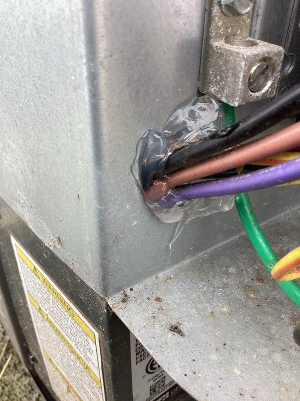 Completed annual cooling maintenance on 9-year-old EnergiAir system. Performed comprehensive inspection of outdoor condensing unit, including examination of refrigerant lines, electrical connections, and cabinet condition. Verified all electrical wiring connections are secure with proper color-coding intact. Inspected copper refrigerant lines showing normal age-related oxidation with no signs of leaks or damage. Documented equipment condition through photos showing all major components, wiring harnesses, and brass fittings in proper working order with typical wear for unit age.