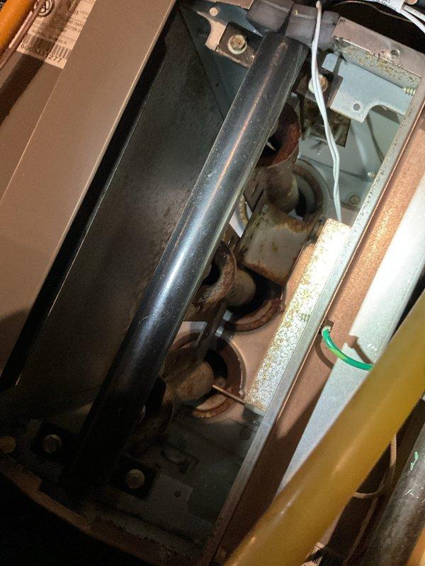 Responded to no-heat call on 20-year-old Lennox furnace. Upon inspection, found extensive rust and corrosion throughout critical mechanical components, including blower assembly mounting brackets, connecting joints, and fittings. Corrosion was severe enough to compromise structural integrity and safe operation of the unit. Documented deteriorated condition with photographs showing oxidation on metal surfaces, corroded mounting hardware, and aging internal components. Due to the age of the equipment and extent of deterioration observed, recommended full system replacement as the most cost-effective and safe solution rather than attempting repairs on compromised components.