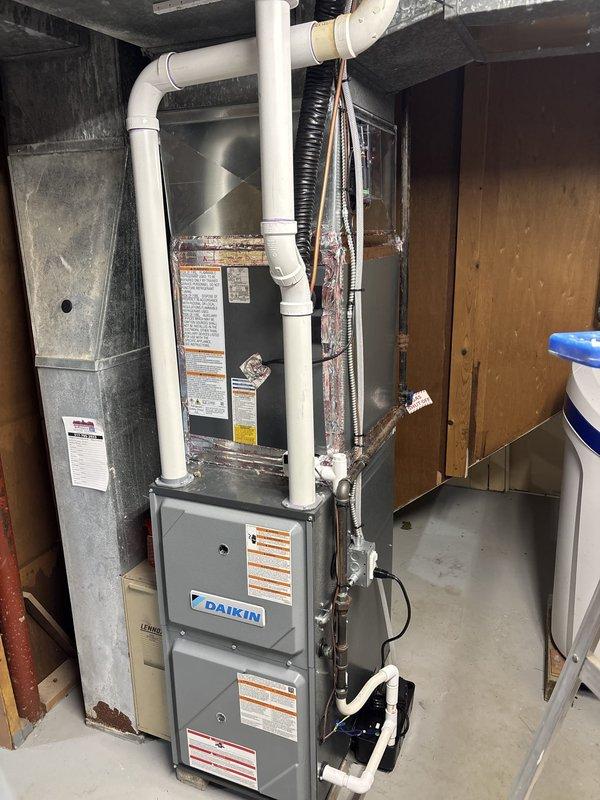 Responded to customer complaint of cold air infiltration from ductwork system. Inspected Daikin furnace installation and associated ductwork in mechanical room, identifying air leakage points around duct connections. Sealed compromised duct joints and connections to eliminate unwanted air flow and improve system efficiency.