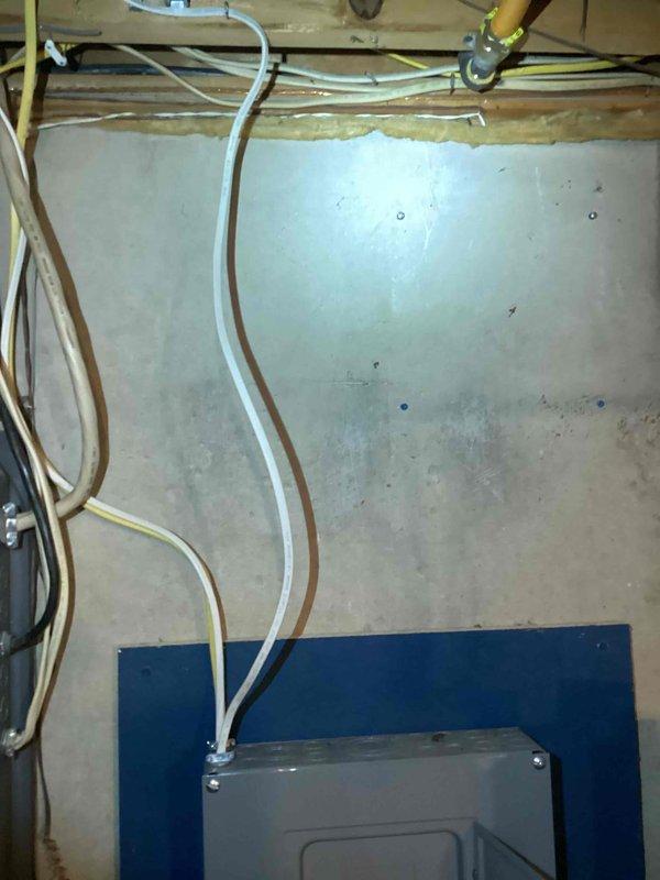 Conducted comprehensive site evaluation for whole-house generator installation and associated electrical panel upgrade. Assessed existing exterior electrical meter configuration mounted on brick wall, documenting current service entrance with dual conduit runs and analog metering equipment to determine integration requirements for new generator system. Evaluated interior utility space to identify optimal routing for generator transfer switch installation, noting existing gas line infrastructure, electrical conduit pathways, and available mounting locations on finished drywall surfaces. Documented ceiling joist configuration and existing utility penetrations including PVC plumbing, copper gas lines, and electrical conduit to plan proper clearances and code-compliant installation pathways. Prepared detailed estimate covering generator unit specifications, automatic transfer switch installation, electrical panel upgrade requirements, necessary permits, and integration with current service