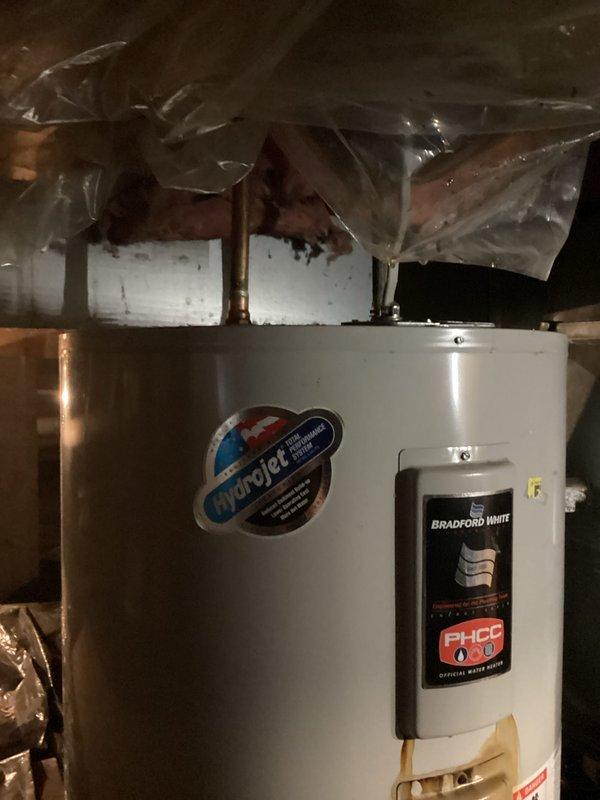Evaluated existing Bradford White water heater in crawl space, determined unit to be approximately 10-12 years old and in need of replacement due to age. Documented current installation including copper piping connections, Carrier HVAC system proximity, and crawl space access conditions with vapor barrier present. Provided estimate for water heater replacement to customer.