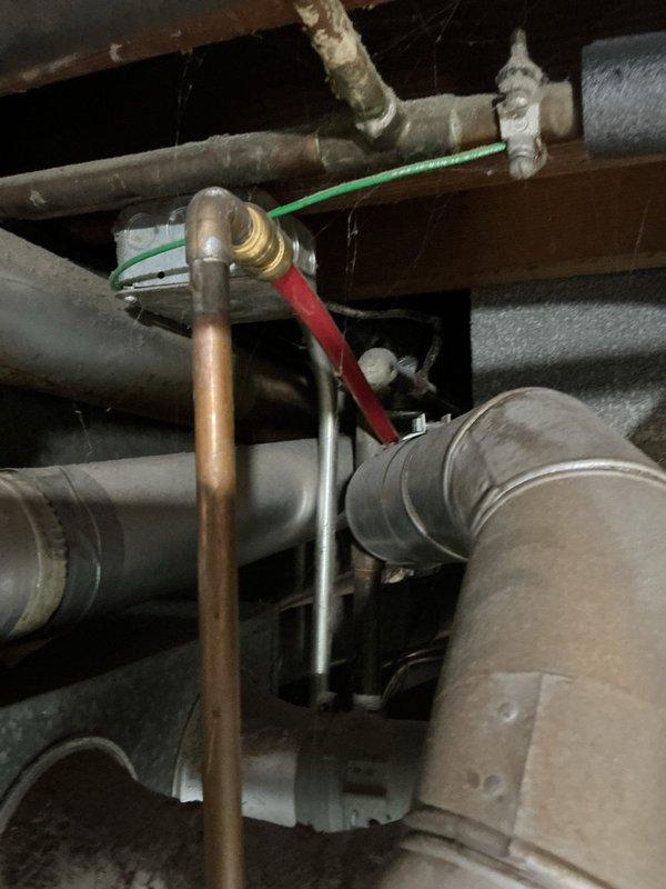 Provided estimate for replacement of 19-year-old GE 40-gallon water heater in residential utility room. Assessed existing plumbing configuration including copper supply lines, gas valve connections, and drainage system in preparation for new unit installation.