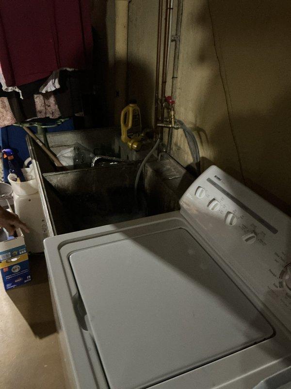 Provided estimate for replacement of 19-year-old GE 40-gallon water heater in residential utility room. Assessed existing plumbing configuration including copper supply lines, gas valve connections, and drainage system in preparation for new unit installation.