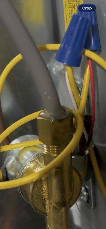 Completed annual heating maintenance visit on 2014 EnergiAir system with humidifier. Inspected electrical connections, service valves, and refrigerant lines; all components found in proper working condition. Documented system configuration with photos showing brass service ports, wire connections with proper wire nut terminations, and refrigerant line routing for service records.