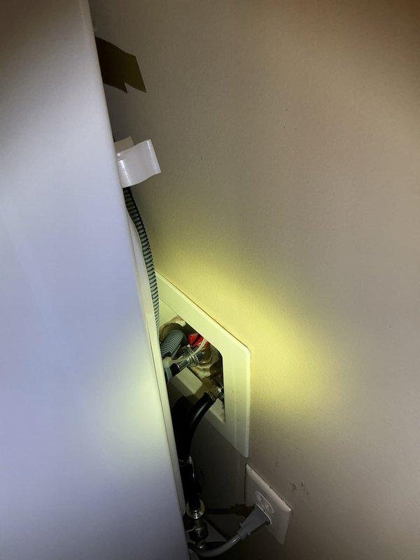 Responded to complaint of intermittent rotten egg odor in laundry room following new washer and dryer installation. Inspected floor drain and washer standpipe drain connections in utility closet. Found dry trap conditions allowing sewer gases to enter living space through floor drain and standpipe. Verified proper drainage function and no visible blockages or standing water present. Advised that newly installed appliances changed usage patterns, allowing drain traps to evaporate between uses. Recommended pouring water into floor drain weekly to maintain trap seal and installing trap primer or deep seal trap for permanent solution.