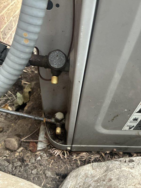 Completed annual cooling maintenance on 25-year-old Carrier system. Inspected indoor and outdoor units, checked refrigerant lines and connections at condenser, documented heavily soiled air filter requiring replacement due to significant dust accumulation and discoloration. All accessible components photographed and system operational at time of service.