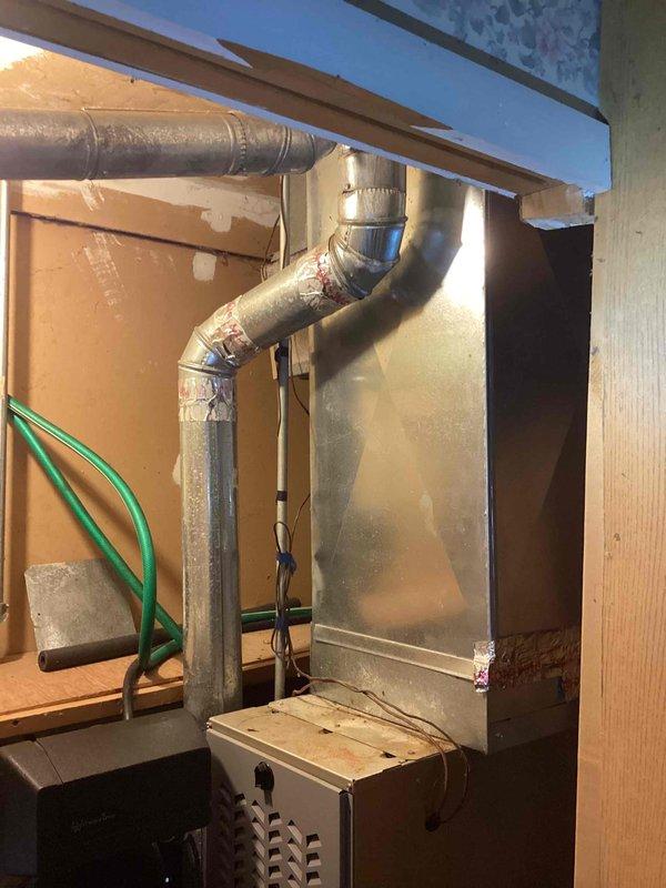 Provided estimate for replacement of 20-year-old non-functional natural gas water heater in garage. Quote includes installation of new unit with elevated positioning and accessible gas shut-off valve installation per customer request. Assessment based on existing water heater configuration with connections including copper supply lines, galvanized vent pipe, and standard gas service.