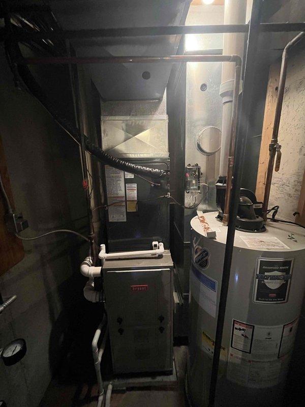 Completed full air conditioning system replacement at residential property. Removed existing AC unit and installed new Bryant system with A2L refrigerant. System was charged with 60 oz factory charge plus 4.05 oz field charge for total refrigerant charge of 64.05 oz. Verified proper refrigerant levels, tested system operation, and confirmed all connections secure. Unit integrated with existing Bryant furnace and ductwork in basement utility area. All work completed per manufacturer specifications and industry standards.
