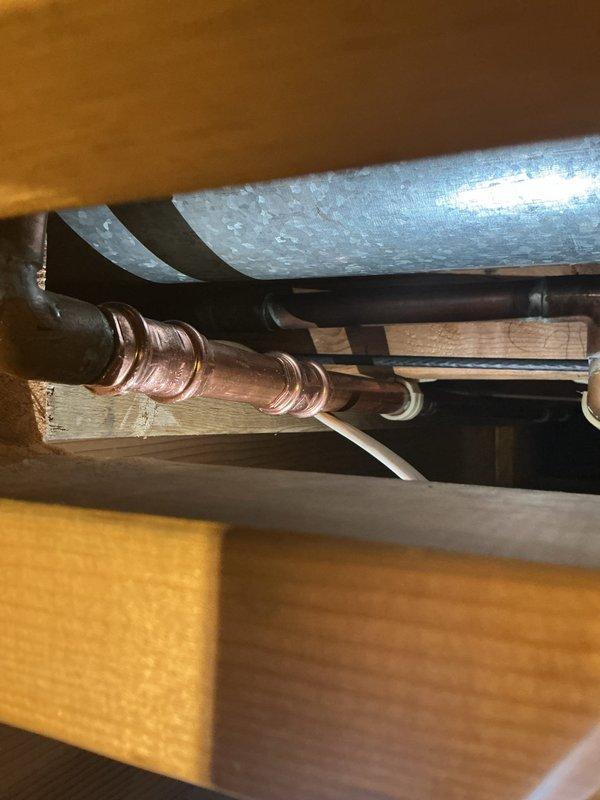 Completed installation of AprilAire manual humidifier unit on existing HVAC ductwork system. Mounted humidifier to main supply plenum, connected water supply line via copper piping, and integrated unit with ductwork to provide whole-home humidity control. System tested and operational upon completion.