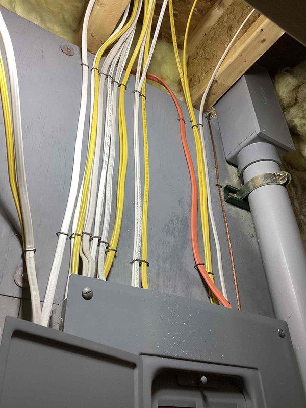 Conducted comprehensive site evaluation for whole-home standby generator installation. Assessed existing electrical infrastructure, including main service panel with dual-column circuit breaker configuration and secondary distribution panel. Documented current electrical routing through basement utility area, noting wire pathways through wall framing and ceiling joists. Evaluated attic space electrical connections and junction box positioning relative to proposed generator placement. Inspected available conduit routing options and existing PVC infrastructure for potential integration. Reviewed client inquiry regarding manufacturer promotional program including extended warranty coverage and rebate eligibility. Photographed electrical panel specifications, wire gauge configurations, and available mounting locations to prepare detailed equipment sizing and installation proposal. Assessment confirmed adequate structural support and clearance requirements for generator unit placement and n