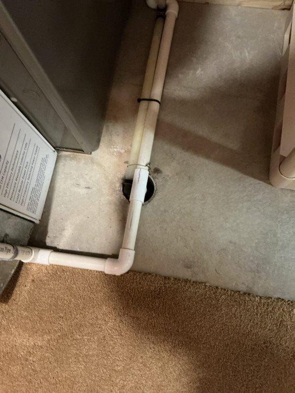 Responded to continuous drain issue on Sterling water softener system. Inspected digital control head displaying zero reading and examined PVC supply/drain line configuration. System evaluated for proper cycling and drain flow control to resolve continuous drainage problem.