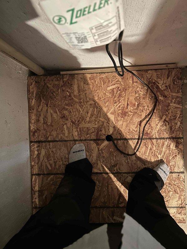 Constructed a 3-foot OSB platform over the sump pump in the utility area to provide safe access and protect the equipment. Additionally, taped and identified the range neutral wire with white marking at the electrical panel to ensure proper circuit identification and code compliance.