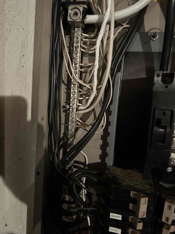 Constructed a 3-foot OSB platform over the sump pump in the utility area to provide safe access and protect the equipment. Additionally, taped and identified the range neutral wire with white marking at the electrical panel to ensure proper circuit identification and code compliance.