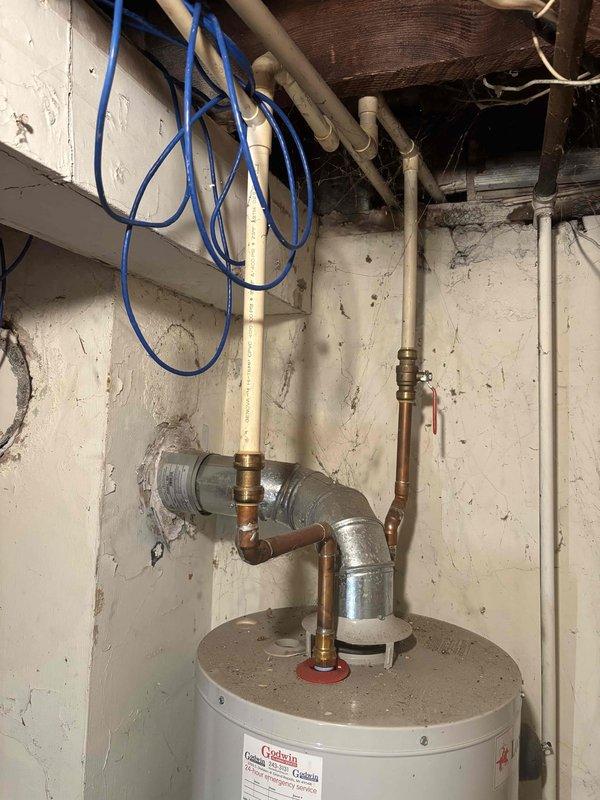 # AC Annual Cooling Maintenance

Completed comprehensive annual cooling system maintenance and inspection. Performed standard tune-up procedures including system diagnostics, operational testing, and visual equipment assessment. All components evaluated and found to be functioning within normal parameters. Documentation photos captured for service records showing mechanical equipment and associated utility connections in the service area.