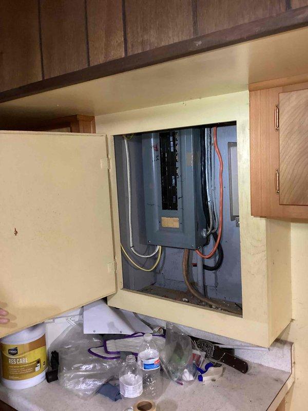 Responded to request for generator installation quote at residential property. Customer indicated existing generator inadequate for current power requirements. Conducted site assessment and documented existing electrical panel configuration, including main load center with multiple circuit breakers and associated wiring. Photographed electrical infrastructure to evaluate capacity requirements and determine appropriate generator sizing for whole-house backup power system. Captured images of interior panel installation showing current breaker arrangement and exterior panel view displaying incoming service conductors. Assessment complete for proposal preparation.