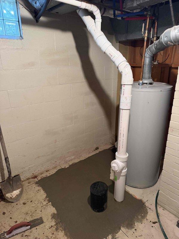 Replaced approximately 12 feet of deteriorated underground drain line in basement area over a two-day period. Coordinated with concrete cutting specialists to excavate and access the failed drainage system, removed compromised piping, installed new drain line, and restored concrete flooring to original grade upon completion.