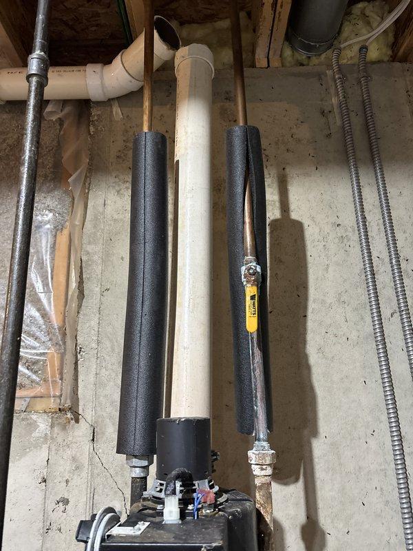 Responded to emergency service call for cracked and shattered water heater ventilation pipe with hot water shut off. Upon arrival, inspected standard tank water heater and found the top PVC vent pipe assembly had failed and required replacement. Replaced damaged ventilation piping with new PVC components, ensuring proper venting and code compliance. Tested system for proper draft and combustion safety. Additionally investigated reported squealing noise from water pump; inspected pump motor and bearings, found minor wear but unit operating within acceptable parameters. Recommended monitoring for future service needs. Restored hot water service and verified all systems functioning properly before departure. Documented conditions with photos for service records.
