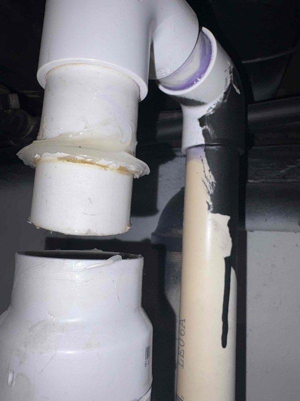 Completed installation of new sump pump system in basement utility area. Installed pump unit in basin with proper discharge piping configuration using white PVC pipe with appropriate fittings, joints, and support strapping secured to ceiling joists. All connections were properly cemented and tested for secure operation and drainage flow.