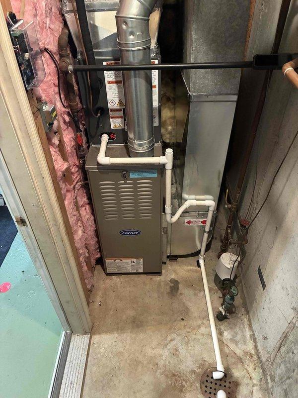 Completed full HVAC system replacement including new Carrier furnace and air conditioning unit. Removed existing equipment and installed new furnace in basement utility area with proper venting configuration using metallic ductwork and PVC condensate drainage lines. Connected all supply and return ductwork to existing distribution system. Installed new AC condenser unit and established refrigerant lines between indoor and outdoor components. Verified all electrical connections, tested system operation across heating and cooling modes, and confirmed proper airflow throughout. System commissioned successfully with all safety controls functioning as designed.