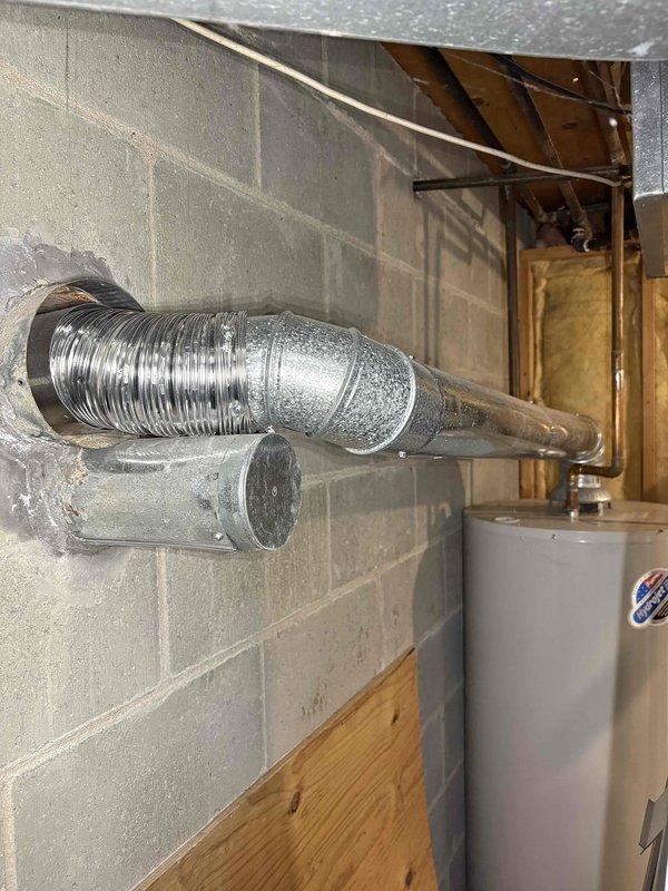 Responded to service call for insufficient hot water and unusual noise from 12-year-old tank-style water heater. Upon inspection, found unit experiencing failure consistent with age and wear. Documented existing conditions including basement installation location and surrounding mechanical systems. Customer reported lukewarm water throughout residence since morning with audible operational noise from unit.