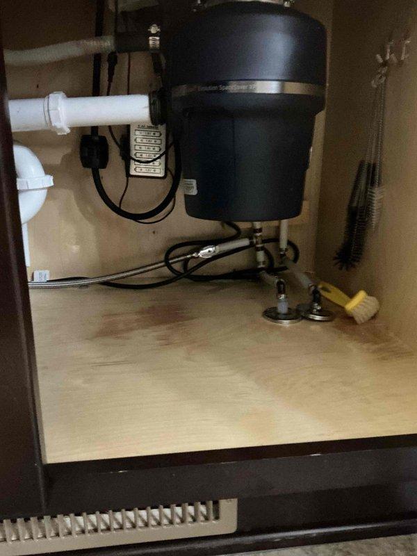 Responded to multiple plumbing concerns including frozen hot water line relocation, replacement of two exterior hose bibs, installation of handheld bidet sprayer at toilet, and repair of leaking drain pipes beneath bathroom causing water intrusion during shower use. Inspected under-sink plumbing connections at garbage disposal and evaluated exterior wall-mounted plumbing fixtures. All requested repairs were assessed and documented with photographic evidence for completion.