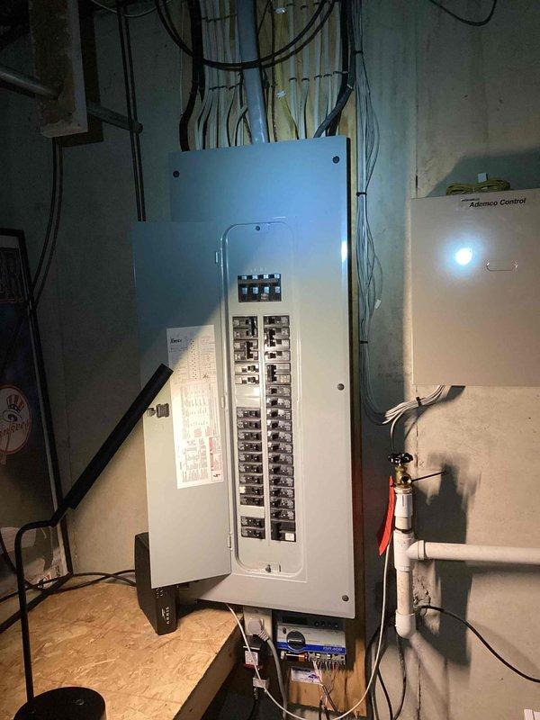 Conducted on-site evaluation for residential backup generator installation at single-family home. Assessed existing electrical infrastructure, including main service panel located in basement utility area with adequate breaker capacity and accessible wiring pathways. Documented electrical panel configuration, available space for transfer switch installation, and routing options for generator connection conduit. Evaluated exterior placement options considering utility access, setback requirements, and fuel line routing from potential natural gas or propane connection points. Photographed current electrical system layout and basement infrastructure to support equipment sizing recommendations and installation planning.