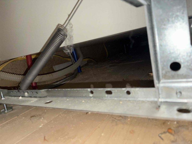 Responded to kitchen water leak complaint with water found under sink and on floor following overnight dishwasher operation. Inspected under-sink plumbing including P-trap assembly, supply lines, and drain connections. Examined cabinet interior for source of leak and documented water damage on cabinet surfaces. Verified hot and cold water supply line connections with shutoff valves and checked all flexible hose connections. Photographed plumbing configuration and affected areas for documentation purposes.