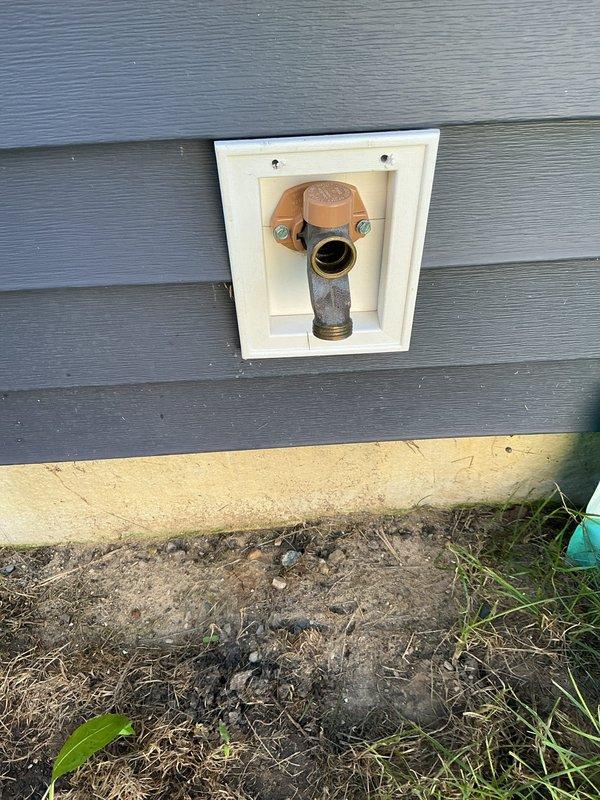 Responded to a non-functional exterior hose bib where the valve handle would turn but no water was dispensed. Successfully replaced the defective hose bib assembly with a new frost-free sillcock, accessing the connection point through the attic space where copper supply lines transition to the exterior fixture. The new installation was properly secured to the exterior wall within the existing recessed mounting box and all connections were tested to ensure proper water flow and operation.