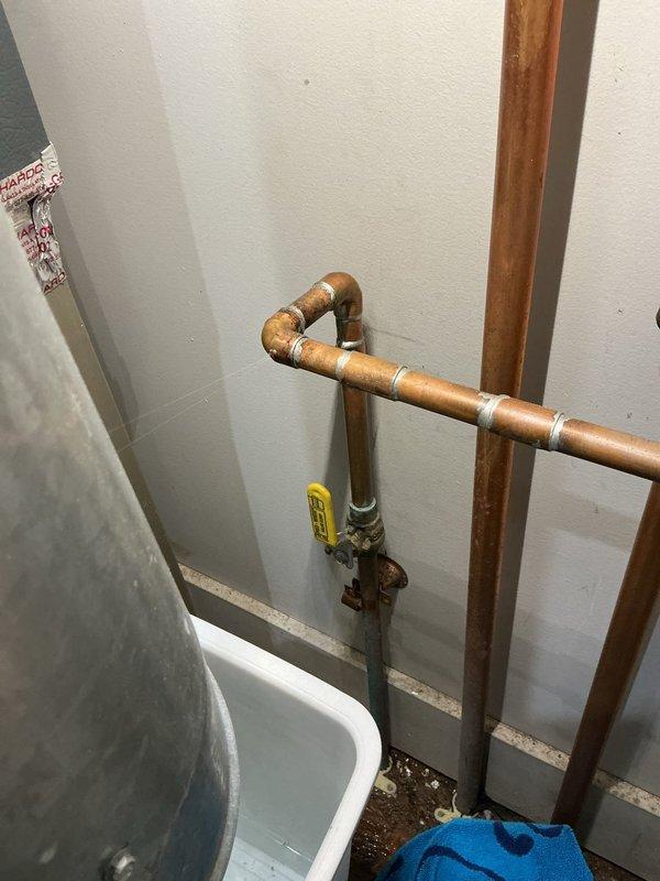 Responded to water leak call for Goodman furnace system. Upon inspection, identified leak source originating from condensate drainage system. Collected water in basin to prevent further damage to surrounding area. Evaluated water heater and associated plumbing connections in utility space, noting copper piping configuration and gas valve positioning. Documented existing conditions of Bradford White water heater installation and connected plumbing infrastructure for reference. Provided membership renewal information as requested.