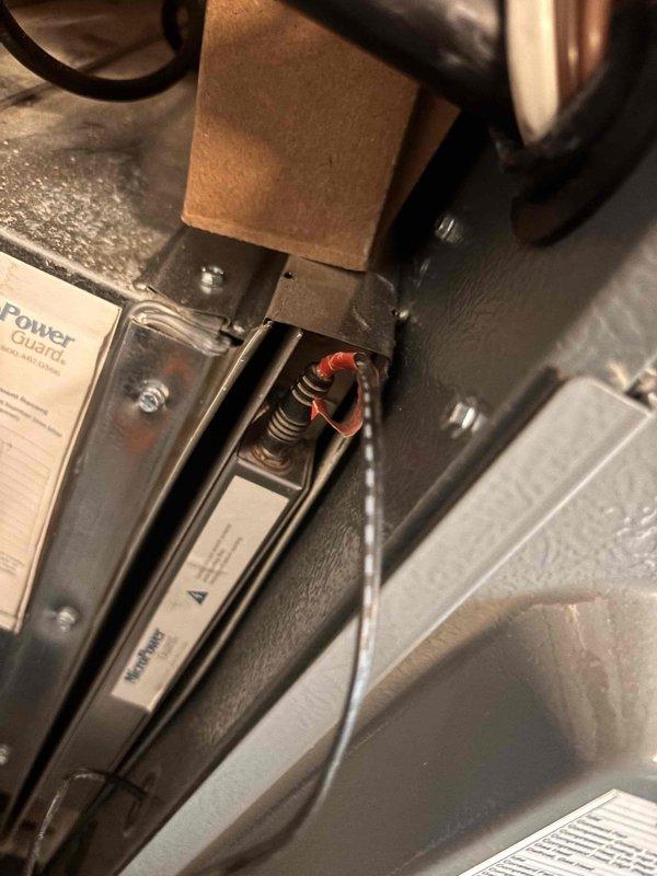 Completed annual cooling system tune-up and preventative maintenance on residential HVAC unit. Inspected electrical components including Power Guard surge protection device and associated wiring connections. Removed and cleaned blower assembly which showed significant accumulation of dust and debris throughout interior compartment. Verified proper operation of all system components and restored unit to optimal working condition.