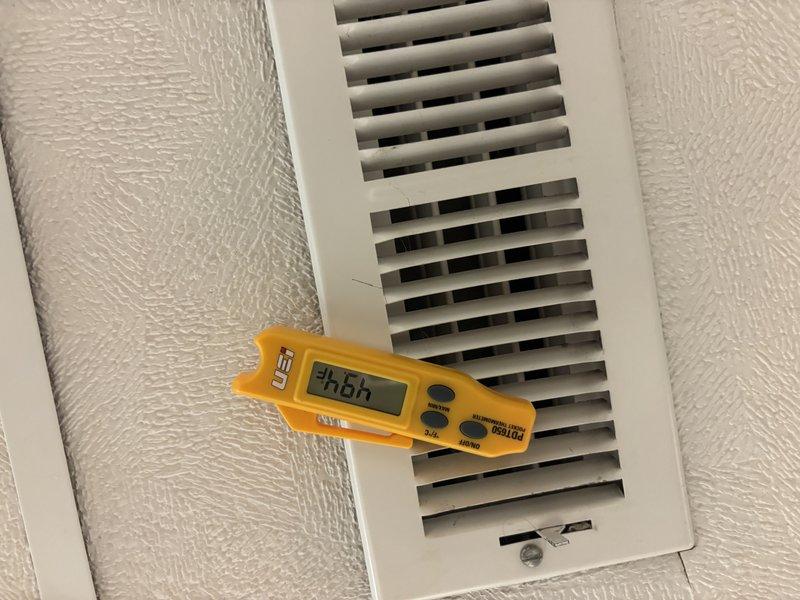 Responded to cooling complaint where AC unit was not reaching set temperature. Performed diagnostic testing at supply registers using digital measurement equipment, recording temperature differentials of -26°F and -86.4°F across multiple vents to assess system performance and airflow distribution. Based on measurements taken, system was evaluated for proper cooling capacity and thermostat calibration issues were addressed to restore unit to normal operation.
