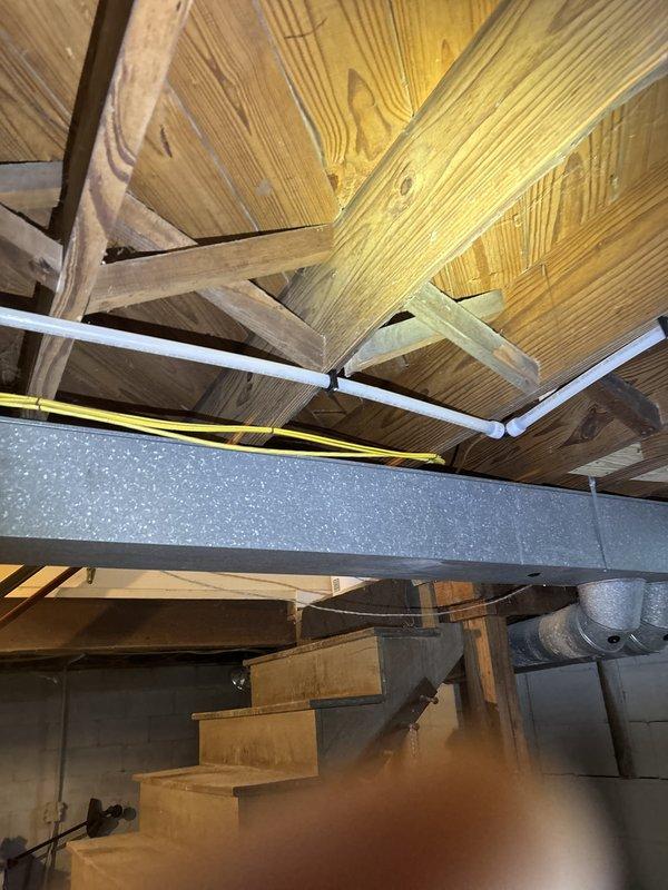 Installed new water supply line to refrigerator for ice maker connection, including dedicated shut-off valve for future service access. Routed copper piping through attic space alongside existing HVAC ductwork and electrical systems, ensuring proper support and clearance from structural members.