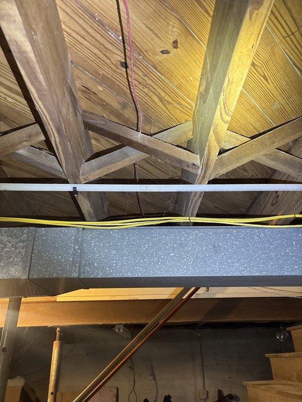 Installed new water supply line to refrigerator for ice maker connection, including dedicated shut-off valve for future service access. Routed copper piping through attic space alongside existing HVAC ductwork and electrical systems, ensuring proper support and clearance from structural members.