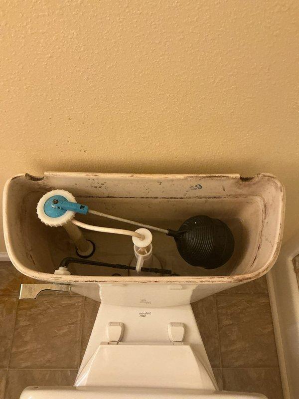 Responded to call for toilet overfilling issue. Upon arrival, removed tank lid and inspected internal flush mechanism. Found fill valve failing to shut off properly at designated water level, causing continuous water flow and tank overfilling. Adjusted fill valve float and water level setting. Tested flush cycle multiple times to verify proper fill valve shutoff and appropriate water level in tank. Confirmed flapper valve sealing correctly and overflow tube functioning as designed. Verified water supply line and angle stop valve connections secure with no leaks present. System operating normally upon completion with tank filling to proper level and shutting off automatically.
