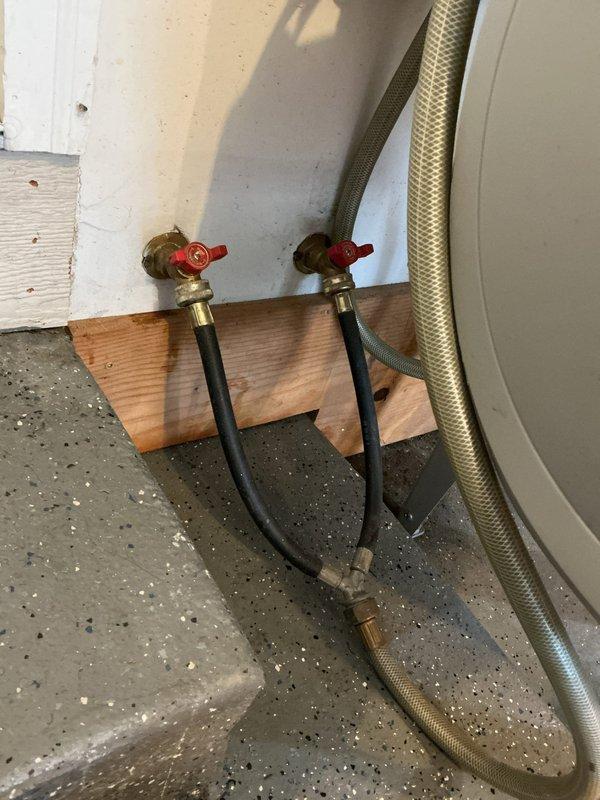 Responded to multiple plumbing concerns throughout the residence. Addressed kitchen sink leak where disposal connection had become disconnected, causing water to back up into the opposite basin. Inspected and repaired leak at utility sink in garage. Investigated lack of hot water supply at garage sink following recent water heater replacement and restored proper hot water flow. Performed integrity assessment of sump pump system to evaluate remaining service life and operational reliability. Diagnosed drainage issue where dishwasher discharge was creating back-pressure in the plumbing system, affecting upstairs bathroom toilet flush performance, indicating potential venting or drain line restriction requiring further evaluation.