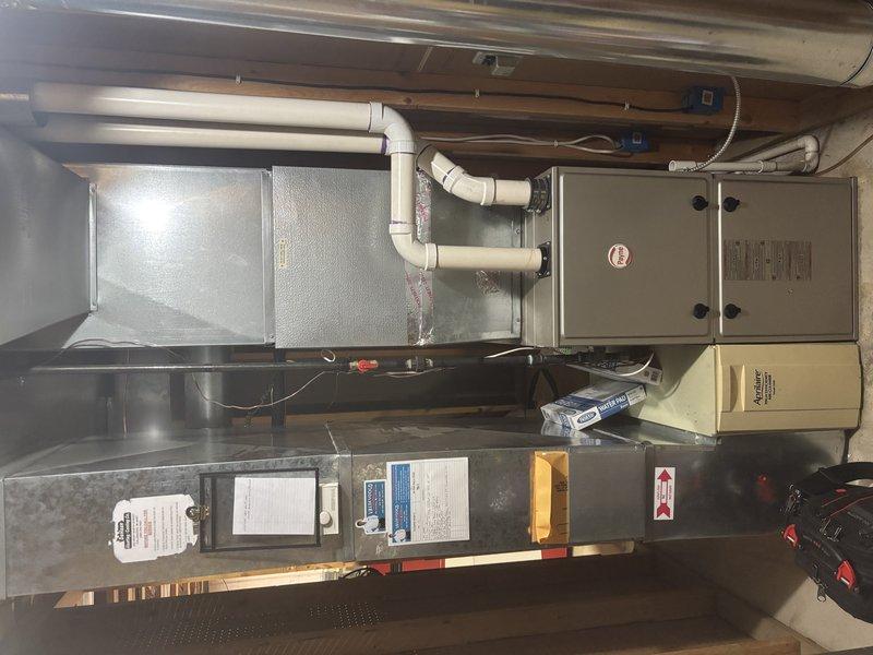 Completed annual cooling maintenance on a 2019 Lennox system. Performed comprehensive tune-up including inspection of indoor furnace/air handler unit with associated ductwork and PVC condensate piping, verified all electrical connections and control operations, and inspected outdoor condensing unit positioned on concrete pad. All components found operating within normal parameters with no issues identified during preventive maintenance visit.