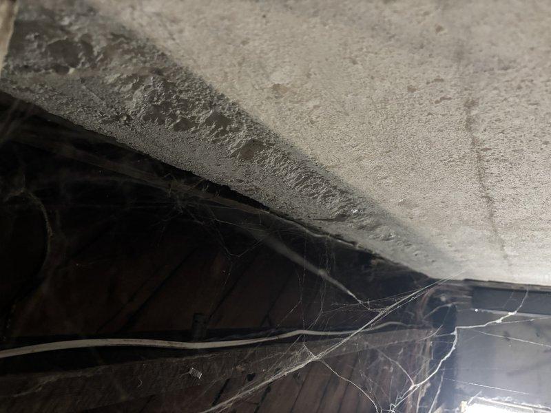 Responded to service call regarding electrical issues following recent HVAC installation, specifically intermittent lighting problems and flickering throughout the home. Upon inspection, accessed crawl space and attic areas to examine ductwork installation and electrical routing. Identified potential interference between newly installed flexible metallic ductwork and existing electrical wiring running through structural spaces. Documented conditions of installation area including ductwork placement, beam clearances, and proximity to electrical components. Photographed installation for warranty documentation and future reference. Verified proper duct insulation and support, noting accumulated debris and cobwebs in service areas indicating previous undisturbed conditions. Recommended follow-up electrical inspection to ensure proper separation between HVAC components and home electrical system to resolve lighting issues that began post-installation.