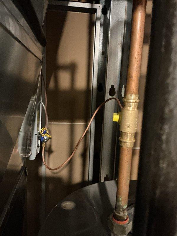 # Humidifier Installation

Successfully installed a whole-home humidifier system with manual control in the HVAC utility area. The installation included mounting the humidifier unit to the existing ductwork, running copper water supply line with shutoff valve, and integrating the system with the forced air system. All connections were secured, tested for proper water flow, and verified operational. The humidifier is now ready to provide moisture control throughout the home during heating season.